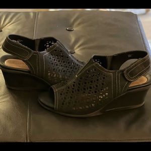 Earth, Wedge heal with cut out detail. Leather upper 10b